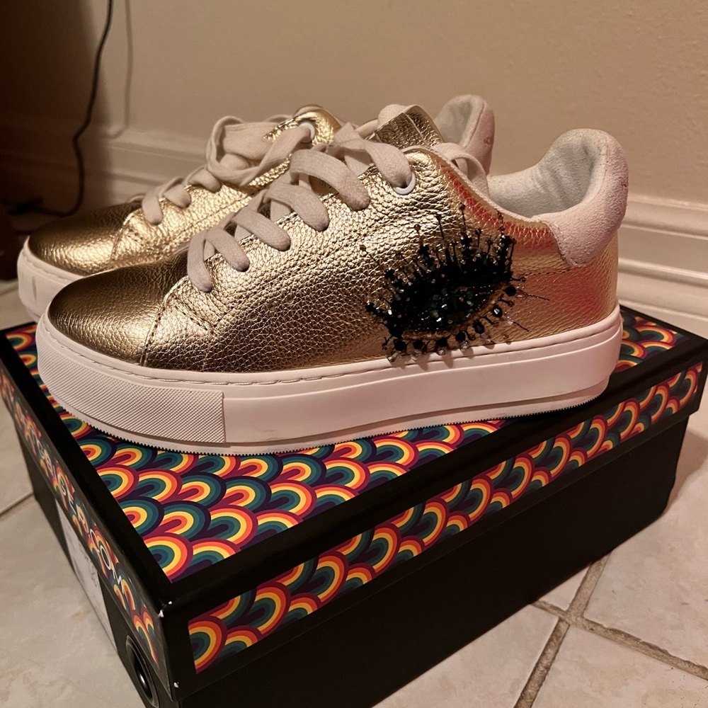 Selling this Kurt Geiger tennis. Hardly worn. Size7 in gold